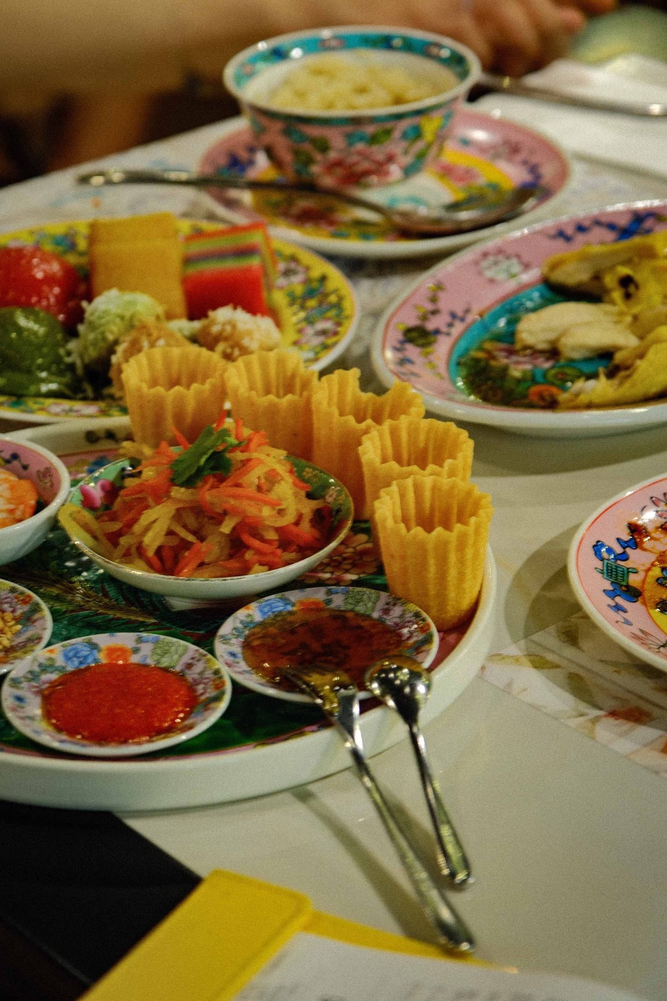 Assortment of small dim sum dishes arranged on a restaurant table