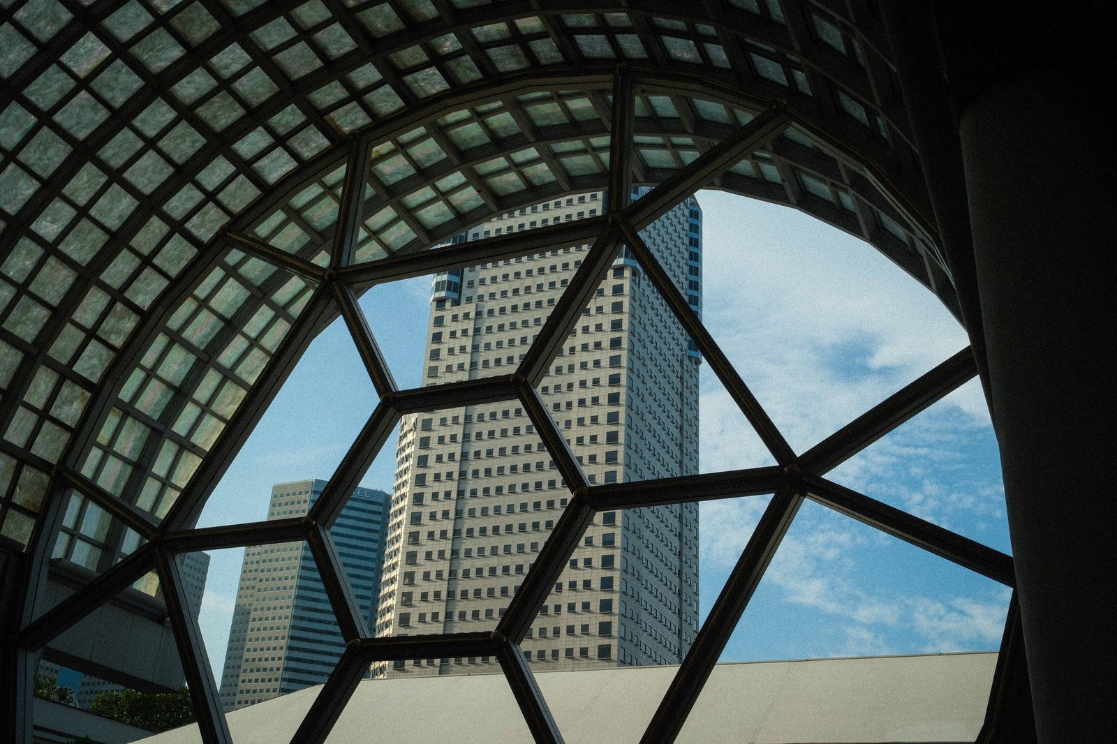 View of city skyscrapers framed through a circular window